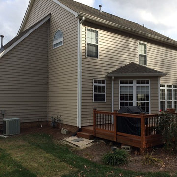 Charlotte, NC, upscale vinyl siding replacement by Belk Builders.