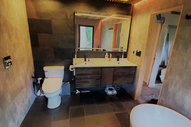 Mid-sized trendy master gray tile and porcelain tile slate floor, black floor, double-sink and wood ceiling bathroom photo in Raleigh with flat-panel cabinets, dark wood cabinets, a bidet, gray walls, an undermount sink, quartz countertops, white countertops and a floating vanity