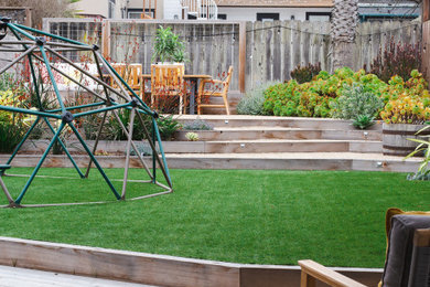 Design ideas for a coastal drought-tolerant backyard decomposed granite and wood fence outdoor playset in San Francisco.