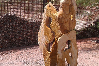 This is an example of a small rustic full sun courtyard concrete paver water fountain landscape in Phoenix for spring.