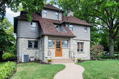 Mid-sized arts and crafts ceramic tile entryway photo in Columbus with beige walls and a medium wood front door
