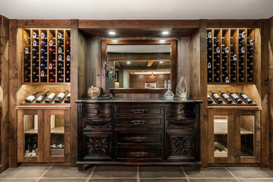 This is an example of a large country wine cellar in Detroit with ceramic floors, display racks and grey floor.