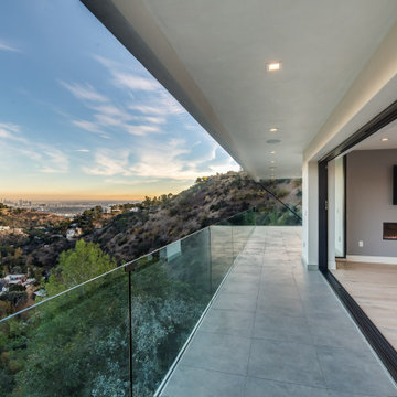 Glass-Rail Balcony Running Alongside the Primary Suite