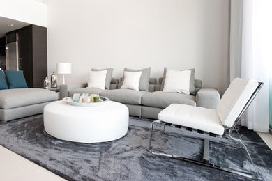 Inspiration for a small contemporary formal and open concept living room remodel in Miami with white walls, no fireplace and no tv
