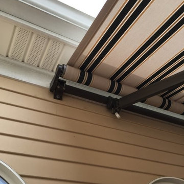 Retractable Awning Creates Shade on a Sunny Deck