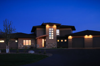 Mid-sized contemporary brown one-story mixed siding gable roof idea in Other