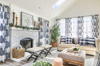 Inspiration for a transitional formal medium tone wood floor and white floor living room remodel in Chicago with white walls, a standard fireplace, a brick fireplace and no tv