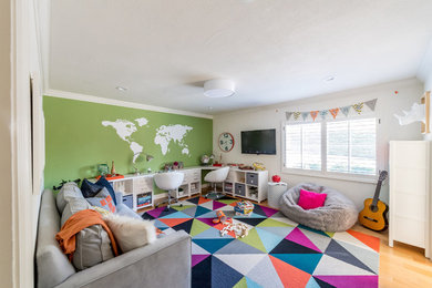 Inspiration for a mid-sized modern gender-neutral playroom remodel in San Francisco with multicolored walls