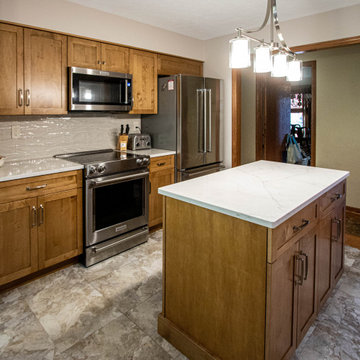 Toffee Stain Shaker Door Kitchen with Calacatta Valetin Quartz Countertops