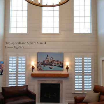 Two story ship lap wall, fireplace surround and mantel shelf.
