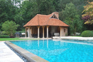 Design ideas for a traditional pool in Hampshire with a pool house.