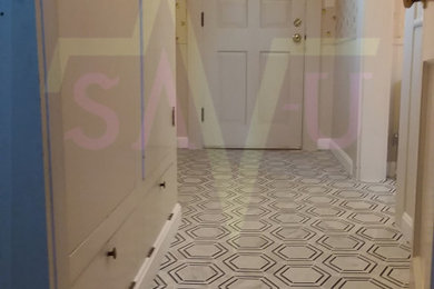 Example of a large cottage marble floor and white floor hallway design in Boston with beige walls
