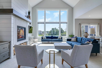 Example of a large trendy formal and open concept carpeted and beige floor living room design in Grand Rapids with white walls, a standard fireplace, a tile fireplace and a wall-mounted tv