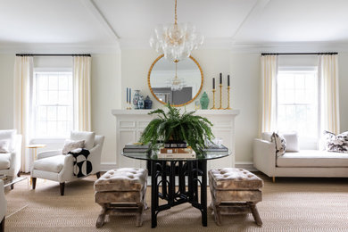 Example of a transitional medium tone wood floor and brown floor living room design in Chicago with white walls, a standard fireplace, a wood fireplace surround and no tv