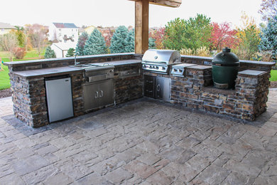 Inspiration for a concrete paver patio kitchen remodel in Omaha