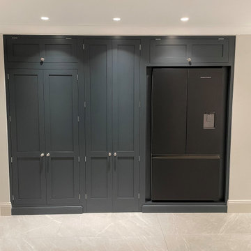 Modern monochrome handmade kitchen with full length larder