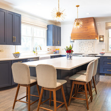 Navy & Walnut Kitchen With Gold Accents and Quartz Island