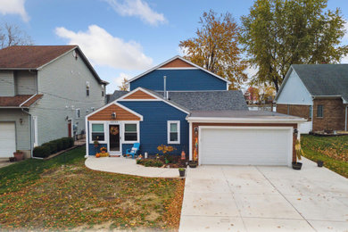 Large transitional two-story exterior home photo in Detroit