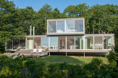 Example of a mid-sized minimalist gray two-story wood exterior home design in Seattle
