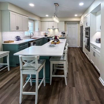 Custom Two-Toned Green and White Kitchen with Laventa Carrara Quartz Countertops