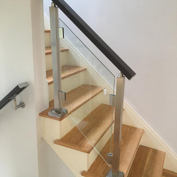 Modern railing system with tempered glass panels NJ