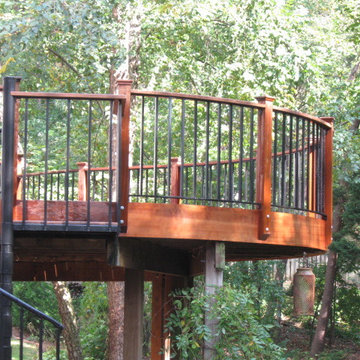 Elevated curved Ipe deck in Herndon, VA, with spiral staircase.