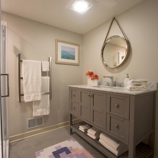 Example of a small transitional 3/4 gray floor and linoleum floor doorless shower design in Detroit with furniture-like cabinets, gray cabinets, gray walls, an undermount sink, marble countertops, a hinged shower door and gray countertops