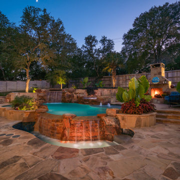 Freeform Pool with Negative Edge, Grotto, and Spa