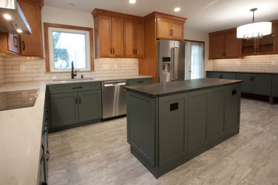 Example of a large transitional ceramic tile and gray floor eat-in kitchen design in Philadelphia with a single-bowl sink, shaker cabinets, green cabinets, marble countertops, white backsplash, ceramic backsplash, stainless steel appliances, an island and white countertops