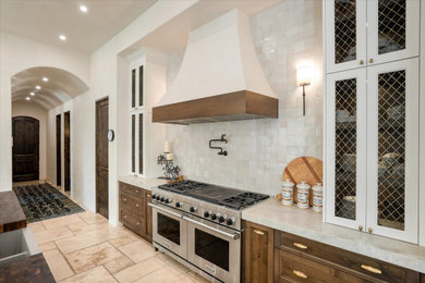 Example of a mid-sized trendy l-shaped kitchen design in Phoenix with recessed-panel cabinets, white cabinets, quartzite countertops, white backsplash, porcelain backsplash, an island and beige countertops