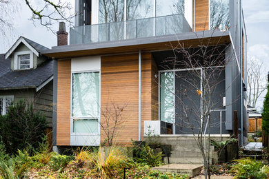 Example of a trendy multicolored two-story exterior home design in Vancouver