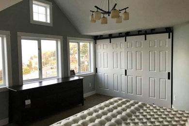 Inspiration for a large transitional master carpeted and brown floor bedroom remodel in Seattle with gray walls and no fireplace