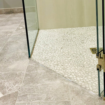 Earthy pebble shower floor tiles