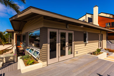 Beach style home design photo in San Diego