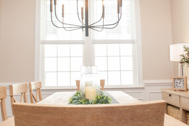 Inspiration for a small transitional dark wood floor and brown floor kitchen/dining room combo remodel in Baltimore with a standard fireplace and a wood fireplace surround