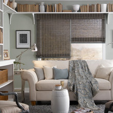 Sofa in front of window with shades