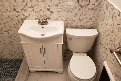 Inspiration for a modern multicolored floor bathroom remodel in Other with white cabinets, a two-piece toilet, multicolored walls and a vessel sink