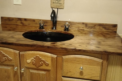Example of a mid-sized mountain style 3/4 single-sink bathroom design in Other with an undermount sink, wood countertops, brown countertops and a floating vanity