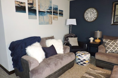 Inspiration for a mid-sized contemporary open concept carpeted living room remodel in Other with blue walls, a standard fireplace, a brick fireplace and a wall-mounted tv