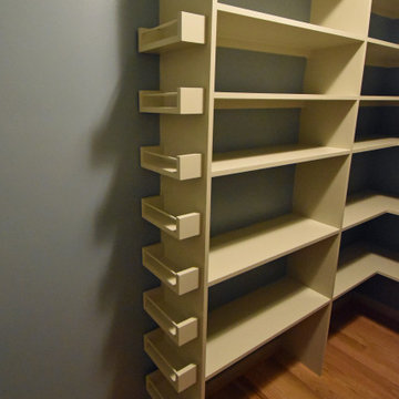 Custom built shelving includes this easily accessible spice rack.