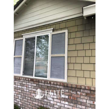 The window shutters on the first and second story Dry Rot Damage Repair