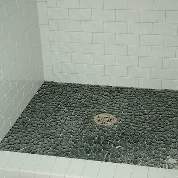 White 3 x 6 subway shower with pebble floor