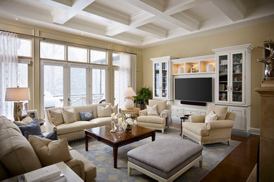 Photo of a large traditional open concept living room in Toronto with beige walls, dark hardwood floors and a built-in media wall.