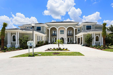Photo of an expansive and gey modern two floor house exterior in Orlando.