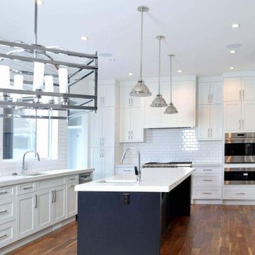A Large Traditional Kitchen white Oxford White cabinets