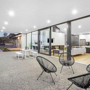 Photo of a contemporary backyard patio in Geelong with a roof extension.