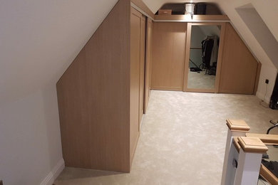 Design ideas for a large contemporary wardrobe in Hertfordshire.