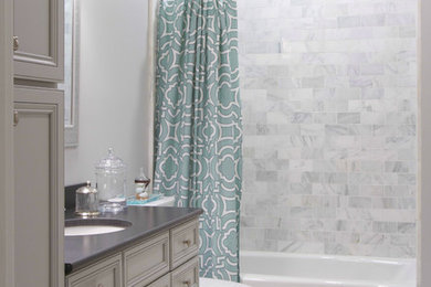 Example of a mid-sized classic gray tile, white tile and marble tile marble floor and multicolored floor bathroom design in Other with recessed-panel cabinets, gray cabinets, gray walls, an undermount sink and quartz countertops