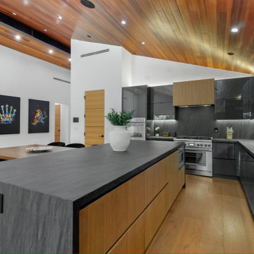 Range Wall with Walnut Hood and Stone Backsplash