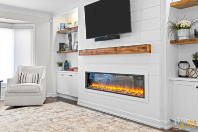 Mid-sized beach style formal and enclosed dark wood floor, brown floor, shiplap ceiling and shiplap wall living room photo in Other with white walls, a standard fireplace and a shiplap fireplace